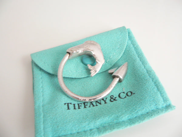 Silver ring with fish design on a Tiffany & Co. branded pouch
