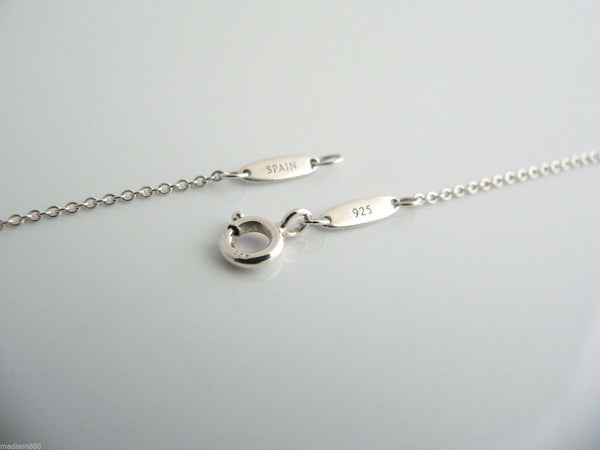 Silver bracelet with clasp on a light gray background