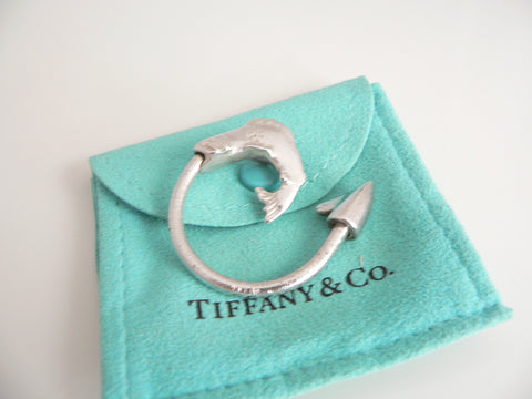 Silver ring with fish design on a Tiffany & Co. branded pouch