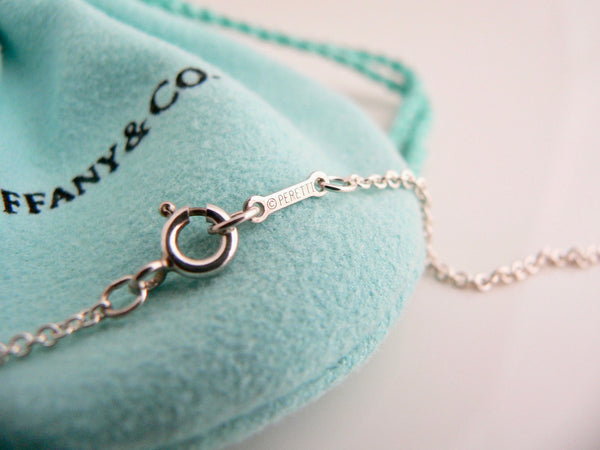 Silver bracelet on a Tiffany & Co. branded pouch