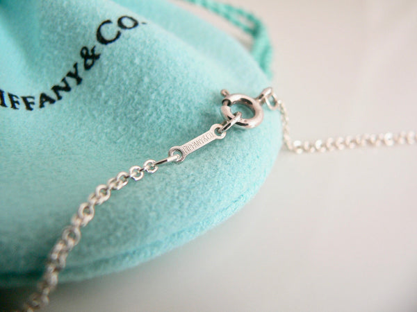 Silver bracelet on a Tiffany & Co. branded pouch