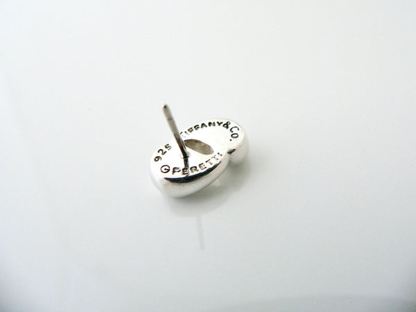 Silver pendant with 'Tiffany & Co' branding on a white background