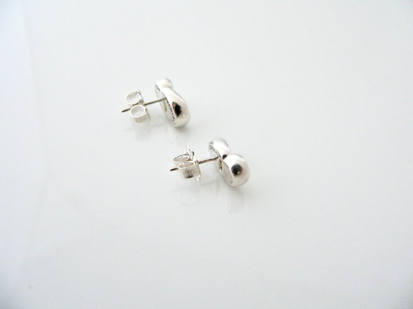 Pair of silver stud earrings on a white background