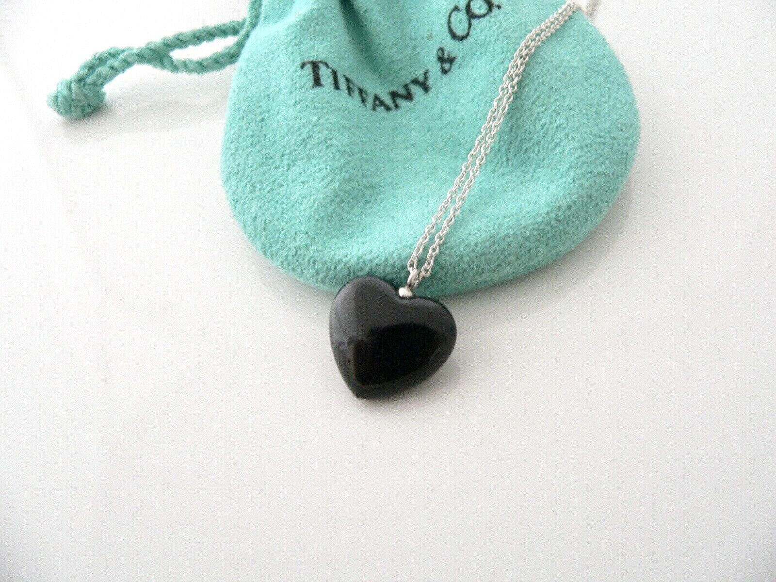 Elsa Peretti® Open Heart pendant of black jade and sterling silver. |  Tiffany & Co.