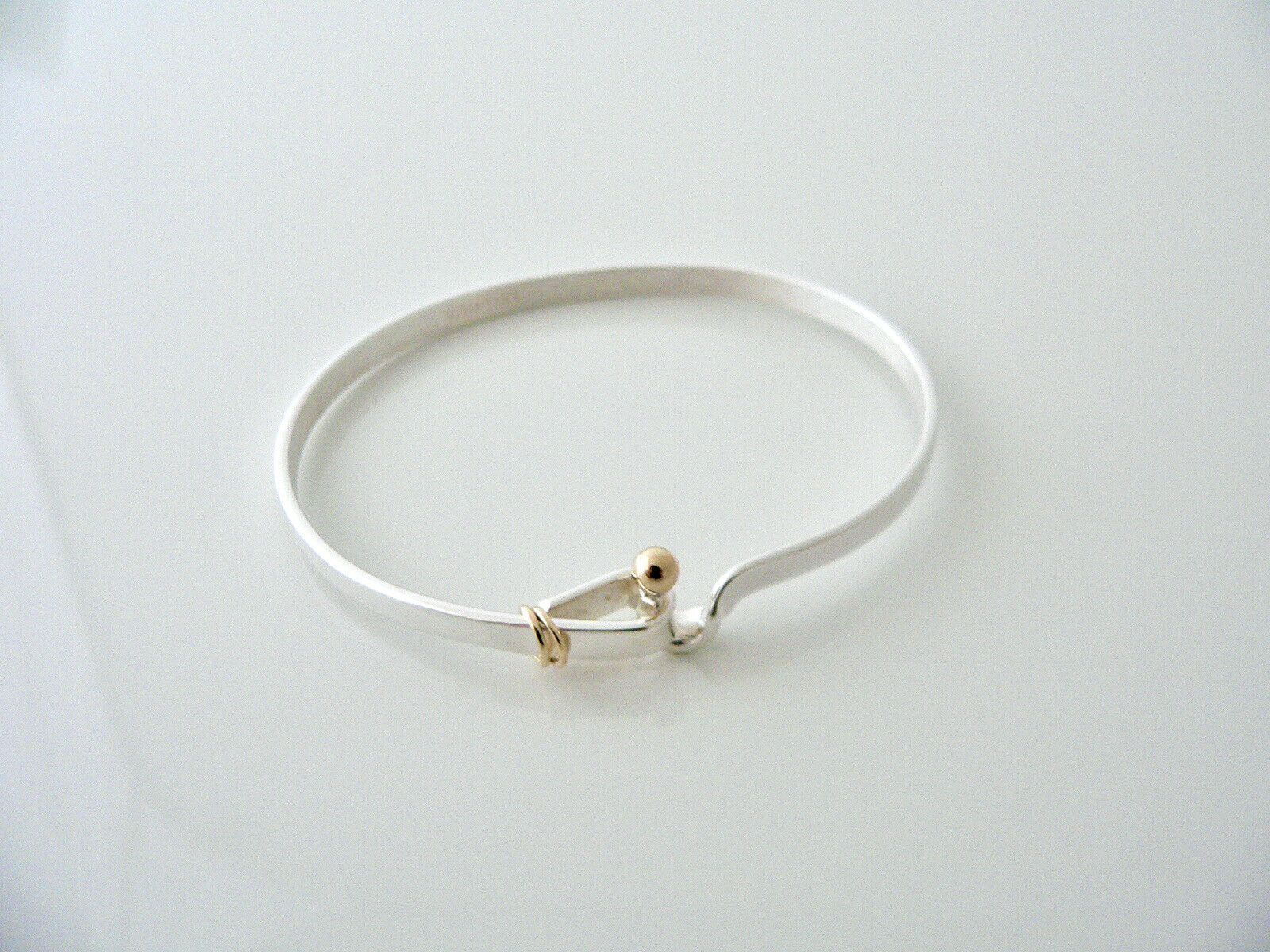 Lot - Tiffany & Co. 18K YG Hook & Eye Bangle Bracelet