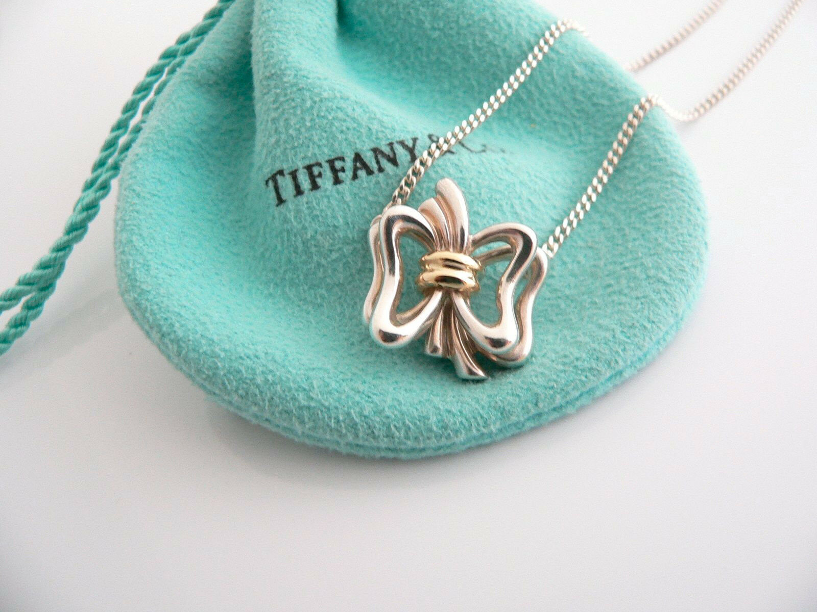 Home › Tiffany & Co Silver 18K Gold Ribbon Bow Necklace Pendant Charm ...